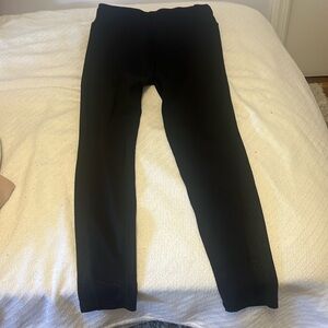 orangetheory black leggings with metallic side leg detail